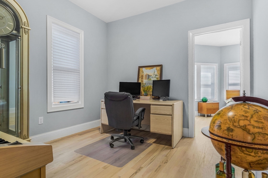 7 Waumbeck Street, Unit 3 Boston, MA 02121 - Photo 11 of 26 a view of a workspace with furniture and a window