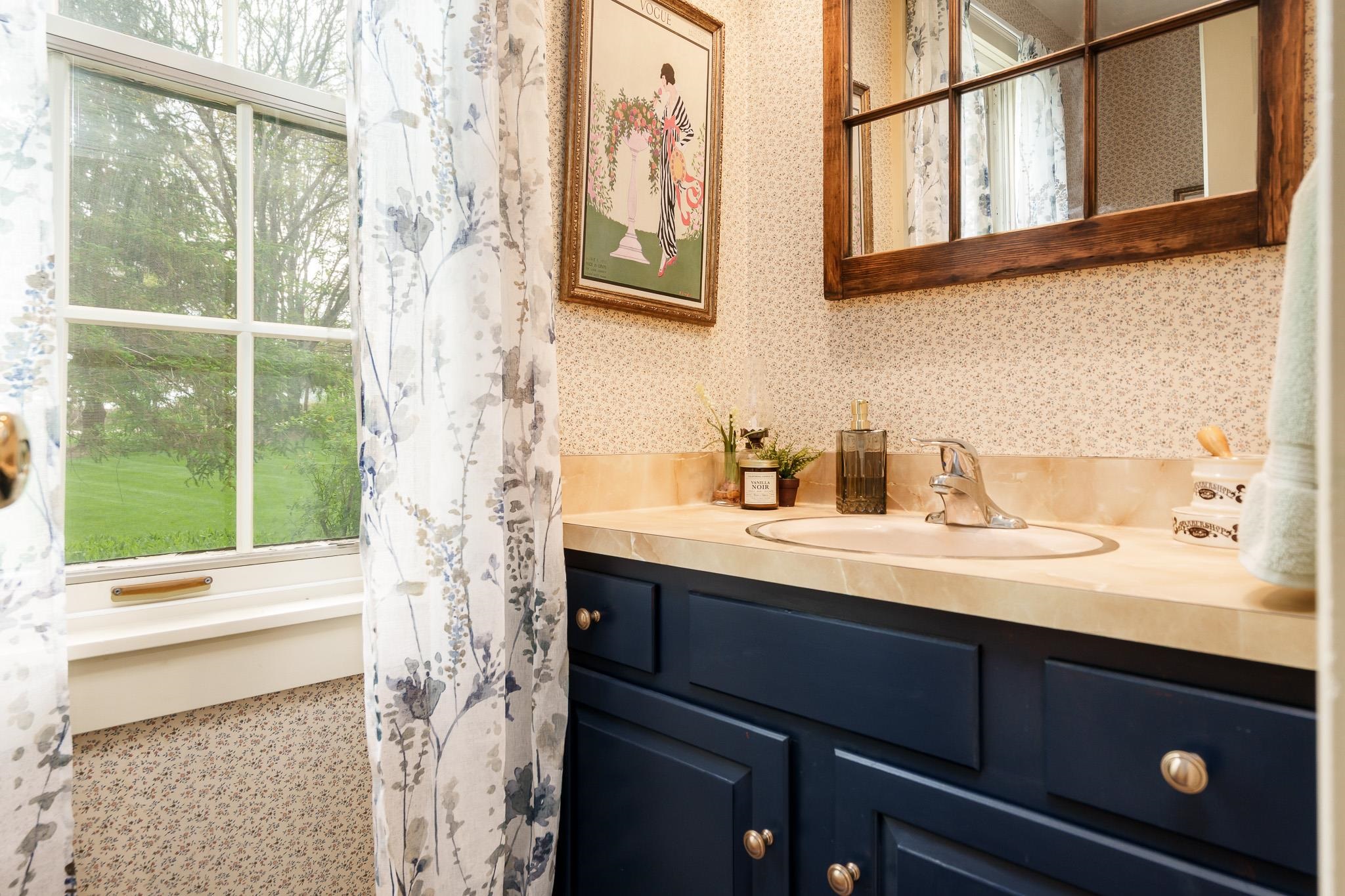 10562 Town Hall Road Belvidere, IL 61008 - Photo 37 of 72 a bathroom with a sink and a mirror