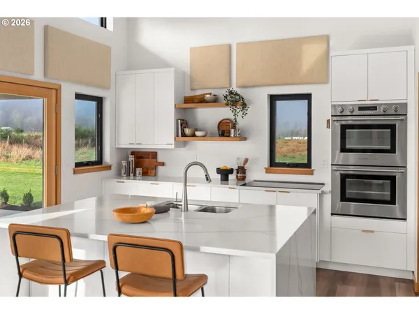 a kitchen with a stove a sink and a microwave