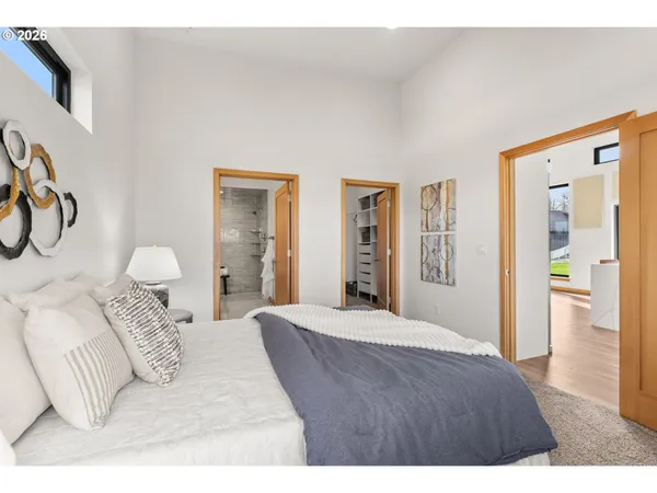 a bedroom with a bed and walk in closet