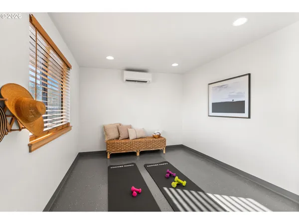 a bedroom with furniture and a window