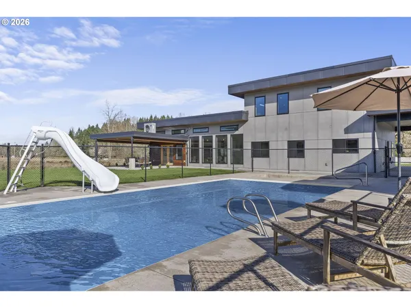 a view of a house with swimming pool