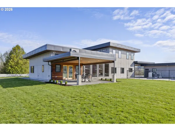 a view of a house with a yard porch and sitting area