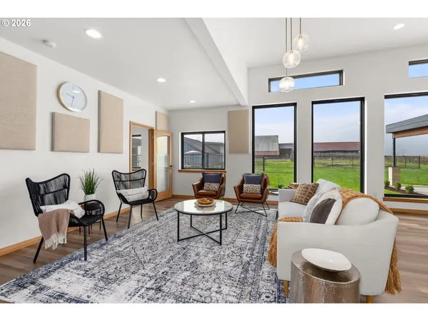 a living room with furniture and a large window