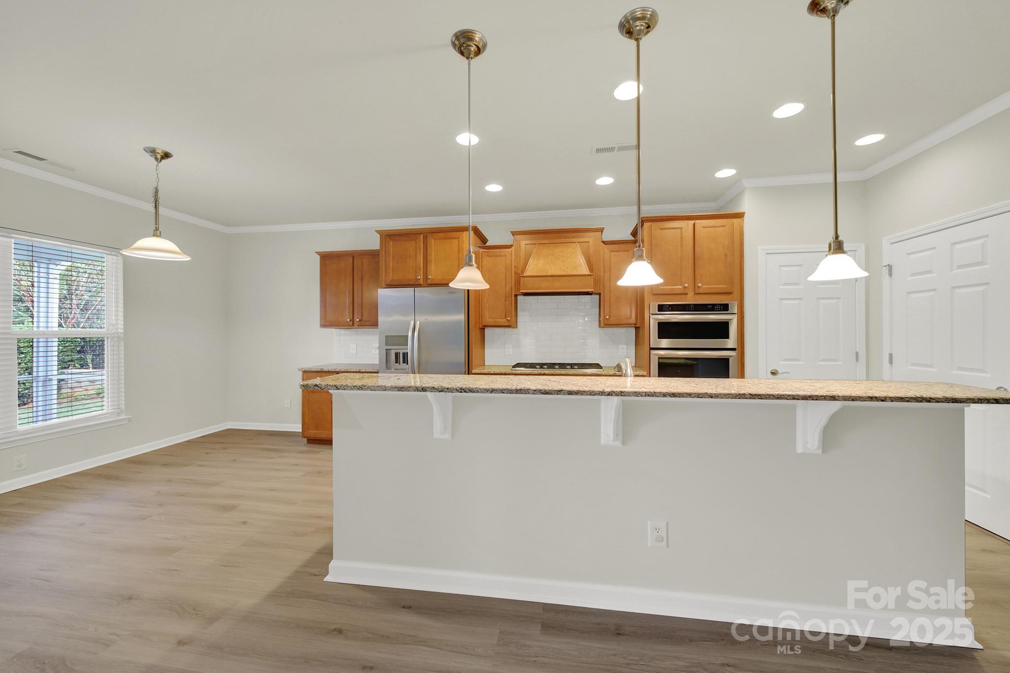 2034 Moultrie Court Fort Mill, SC 29707 - Photo 12 of 46 a view of kitchen with stainless steel appliances granite countertop cabinets a sink and a dishwasher