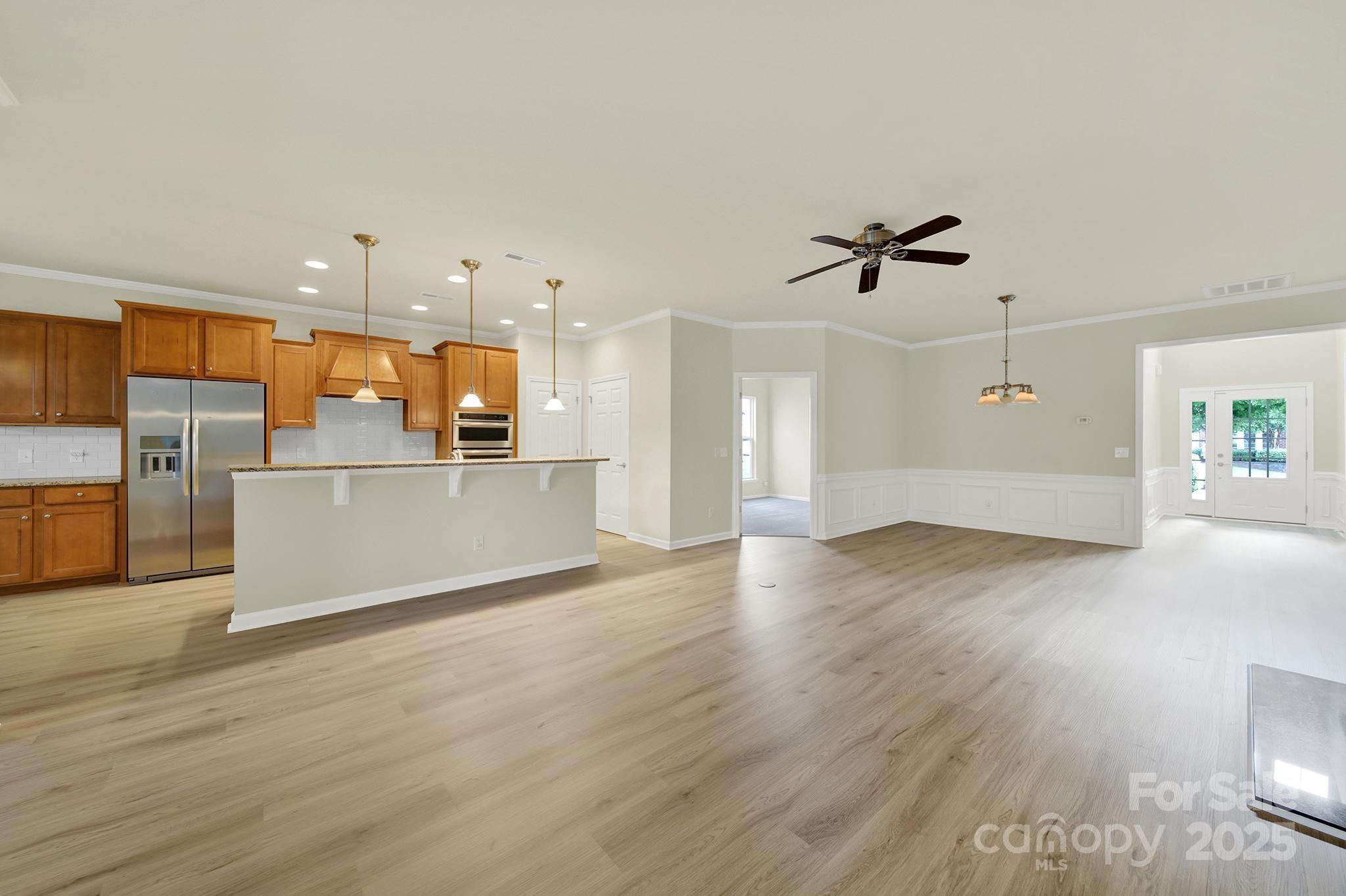2034 Moultrie Court Fort Mill, SC 29707 - Photo 7 of 46 a view of a kitchen with a sink and a refrigerator