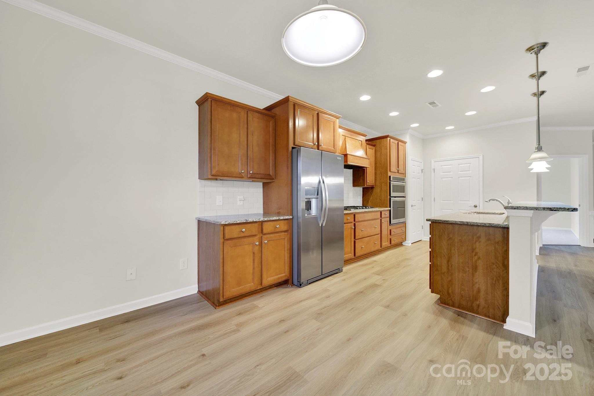 2034 Moultrie Court Fort Mill, SC 29707 - Photo 10 of 46 a view of kitchen with wooden floor