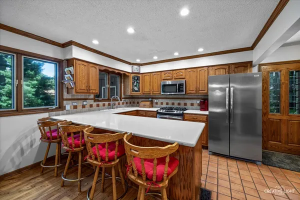 a kitchen with granite countertop a stove and a sink