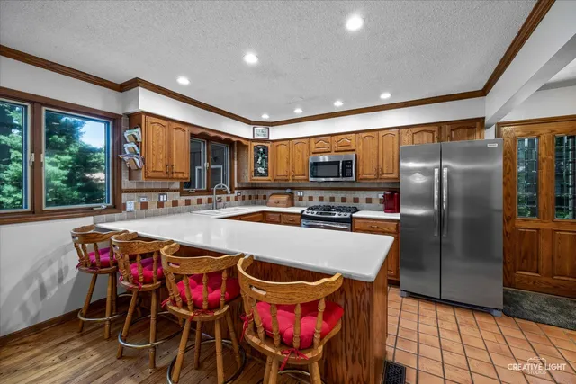 a kitchen with granite countertop a stove and a sink