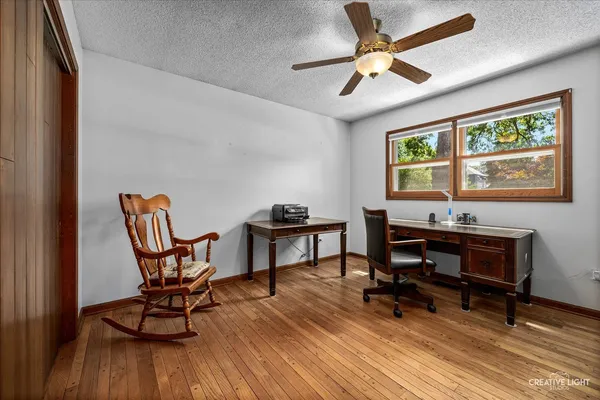 a storage room with washer dryer and cabinets