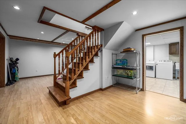 a kitchen with refrigerator and cabinets