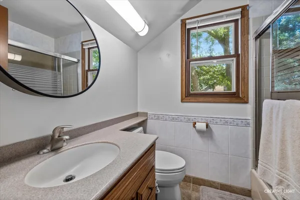a bathroom with a sink and mirror