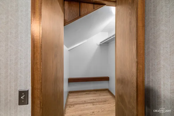 a view of a backyard with wooden fence