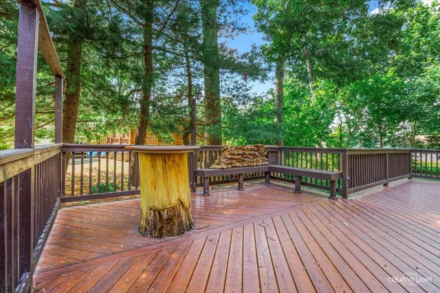 a balcony with table and chairs