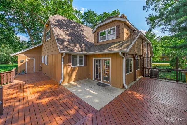 a view of a house with a yard and sitting area