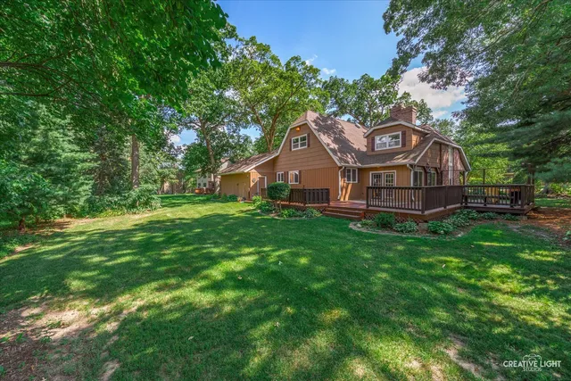 a view of a garden with wooden fence
