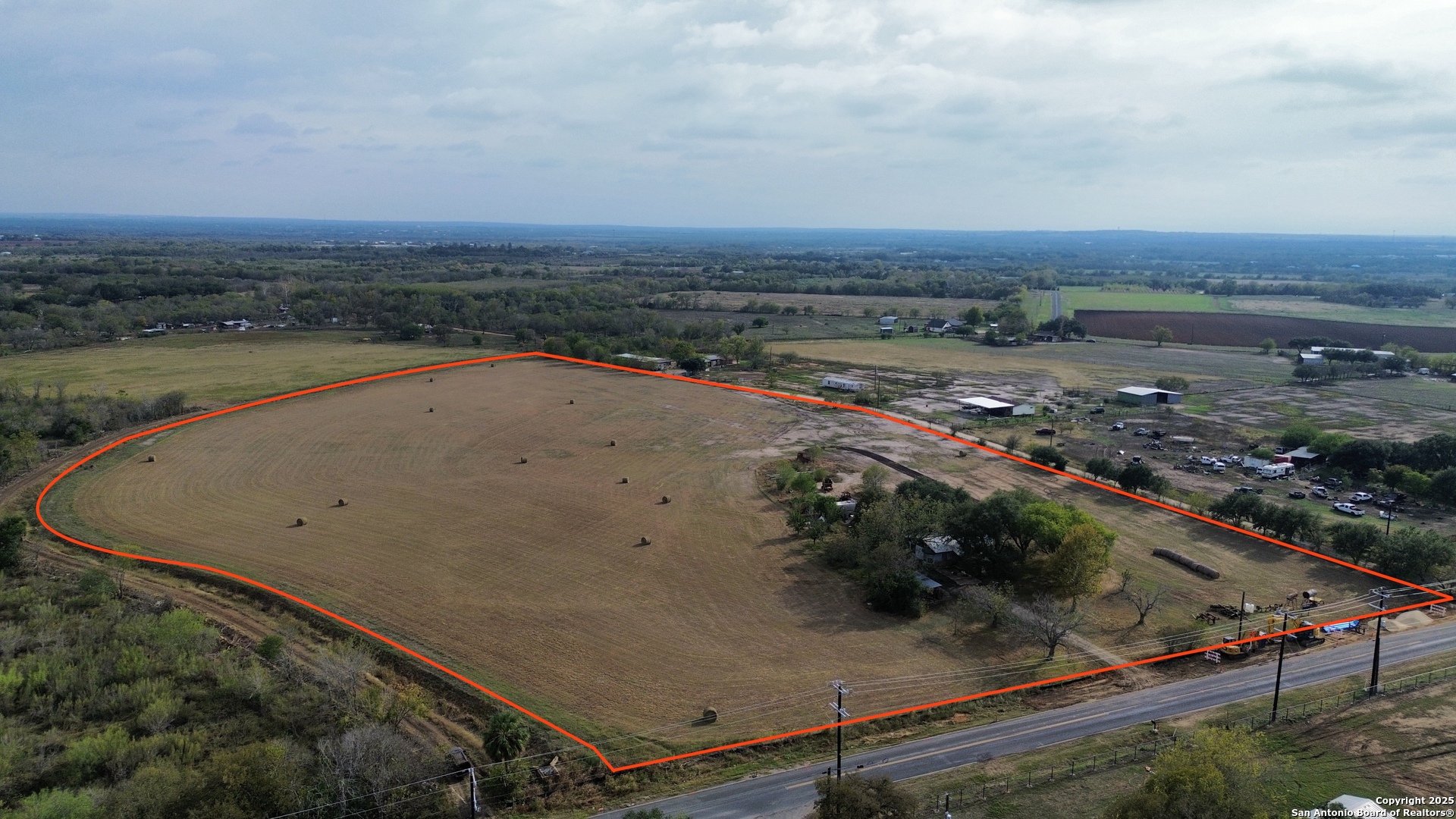 an aerial view of residential houses with outdoor space