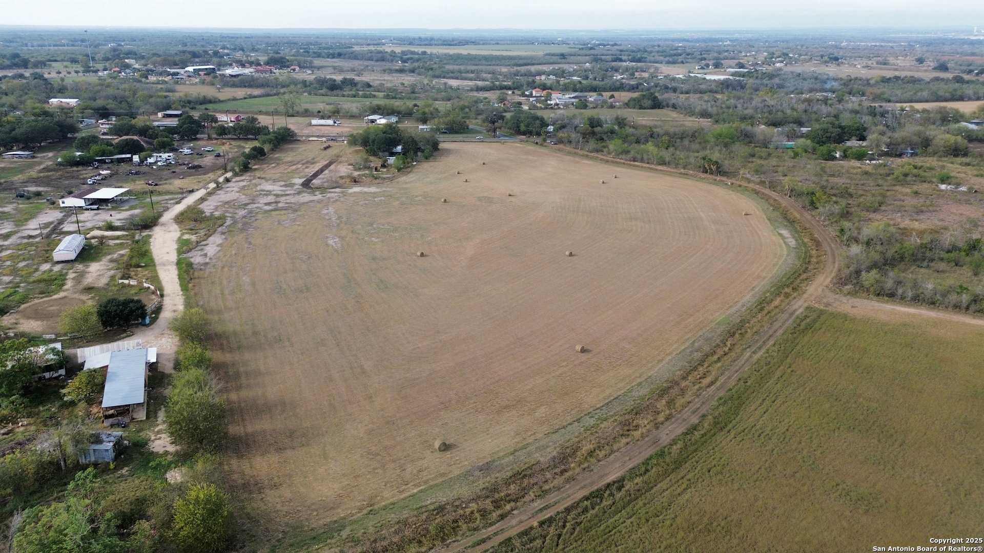 10620 Pearsall Road Atascosa, TX 78002 - Photo 4 of 8 an aerial view of a house with a yard