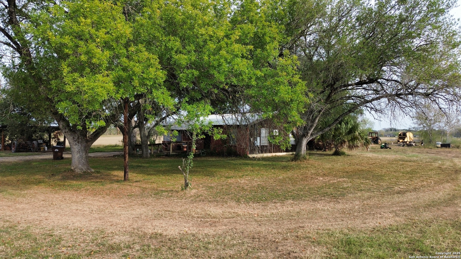 10620 Pearsall Road Atascosa, TX 78002 - Photo 6 of 8 a view of a house with a yard