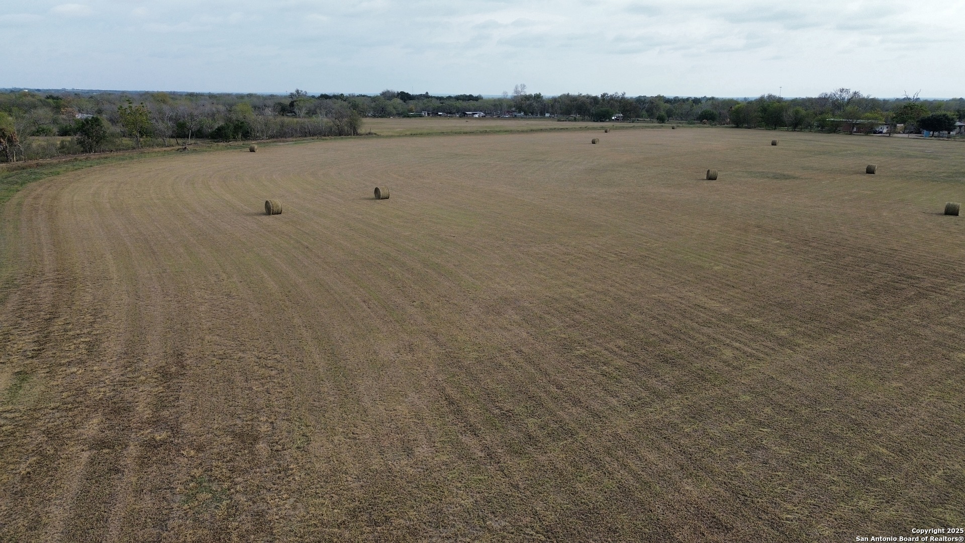 10620 Pearsall Road Atascosa, TX 78002 - Photo 7 of 8 a view of a lake with houses in background