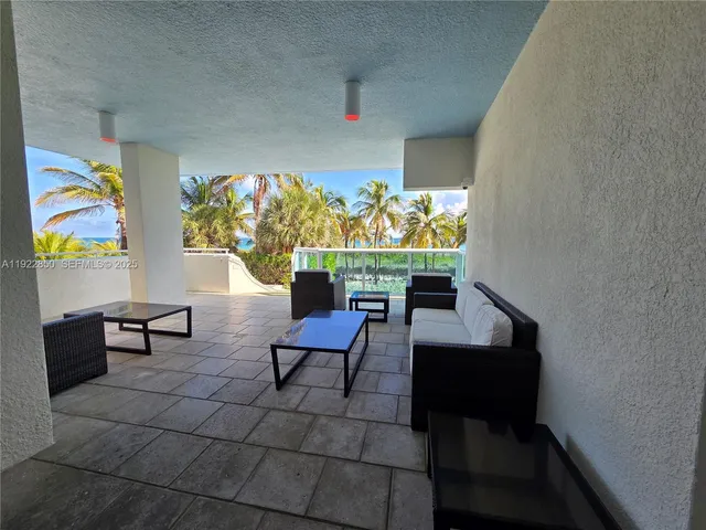 a view of a balcony with chairs