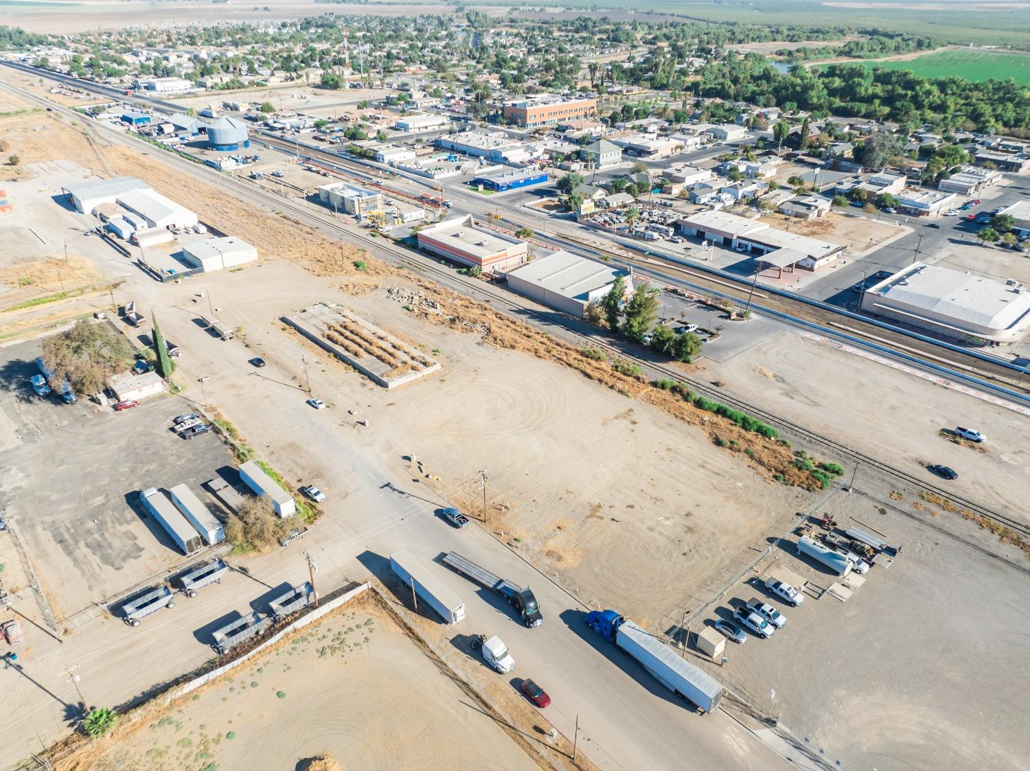 1047 M Street Firebaugh, CA 93622 - Photo 3 of 14 an aerial view of a city