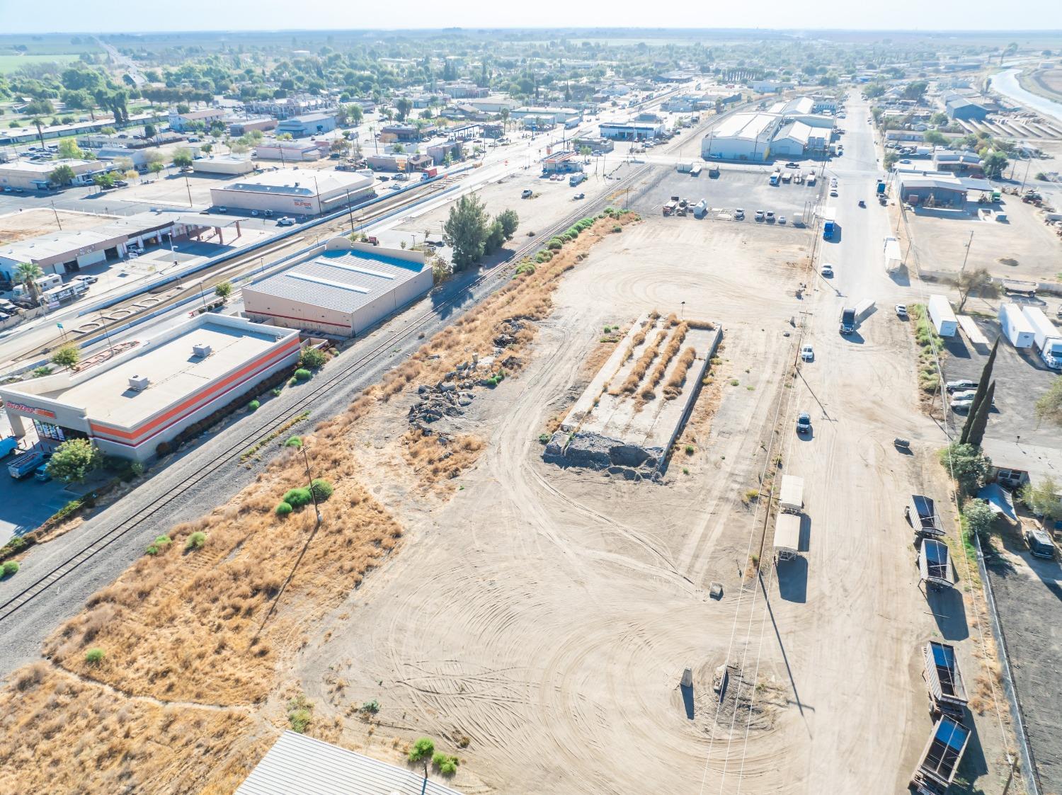 1047 M Street Firebaugh, CA 93622 - Photo 4 of 14 an aerial view of a city