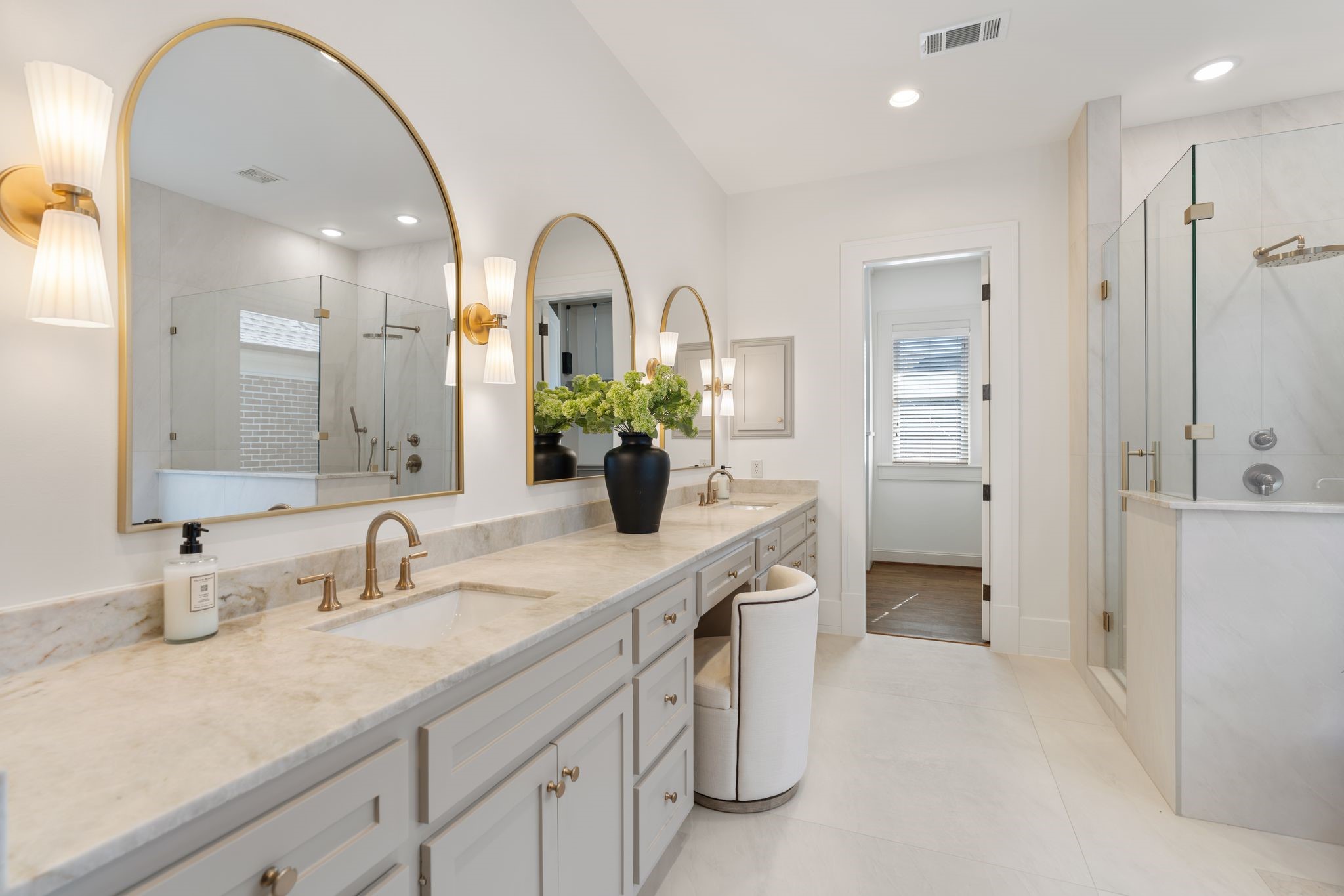 1815 Milford Street Houston, TX 77098 - Photo 14 of 33 PRIMARY BATH - Extensively renovated primary bathroom with Taj Mahal quartzite counters, brass fixtures, designer sconces, double sinks and vanity area.