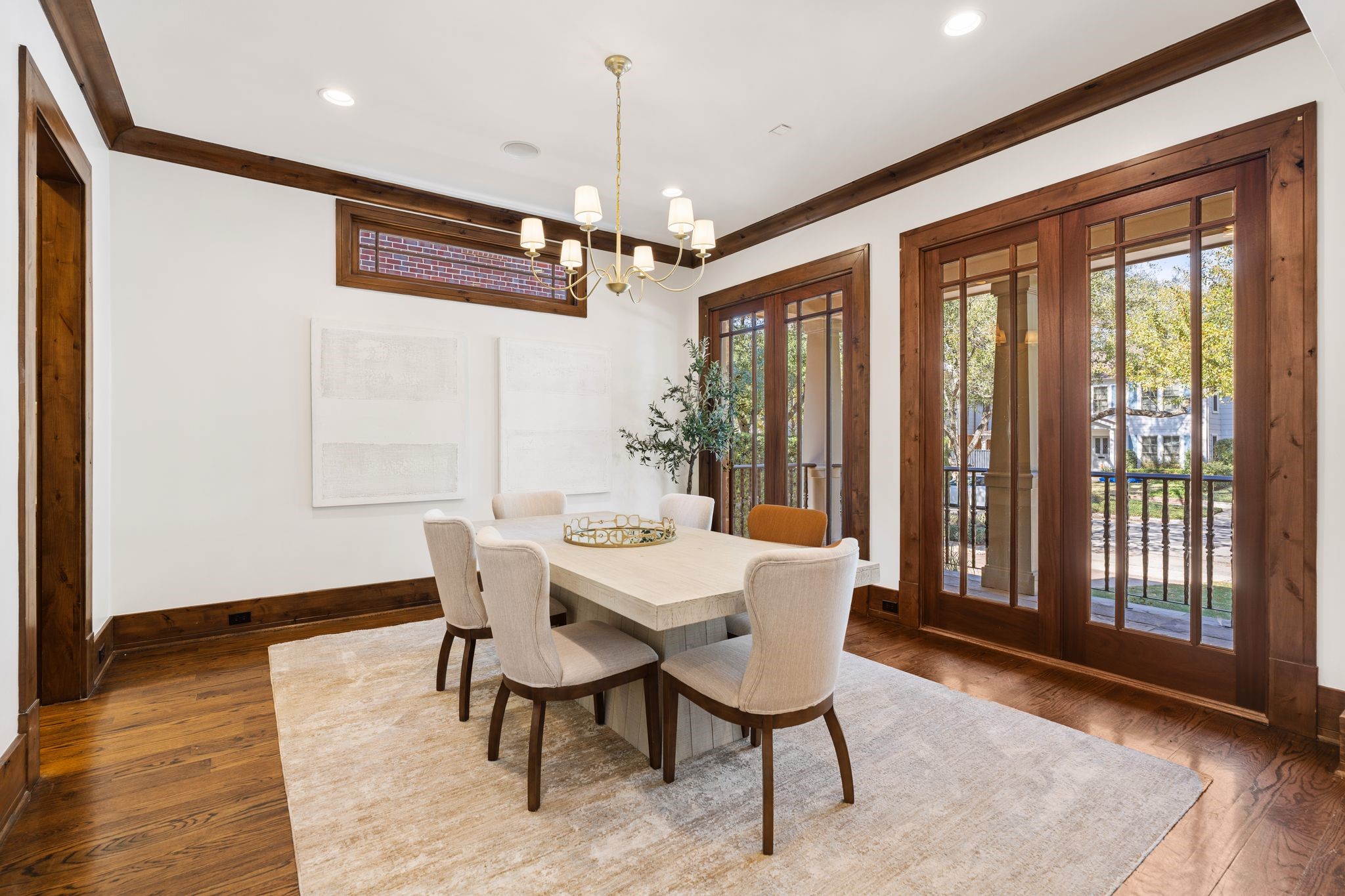 1815 Milford Street Houston, TX 77098 - Photo 10 of 33 DINING ROOM - Spacious dining room with designer chandelier, hardwood floors, crown molding and a wall of windows.