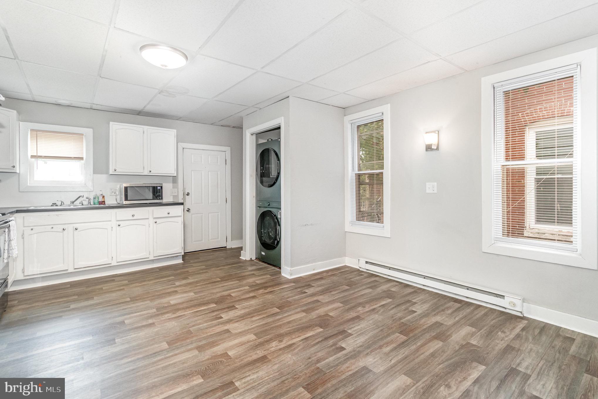 a view of a kitchen with a sink cabinets and a window
