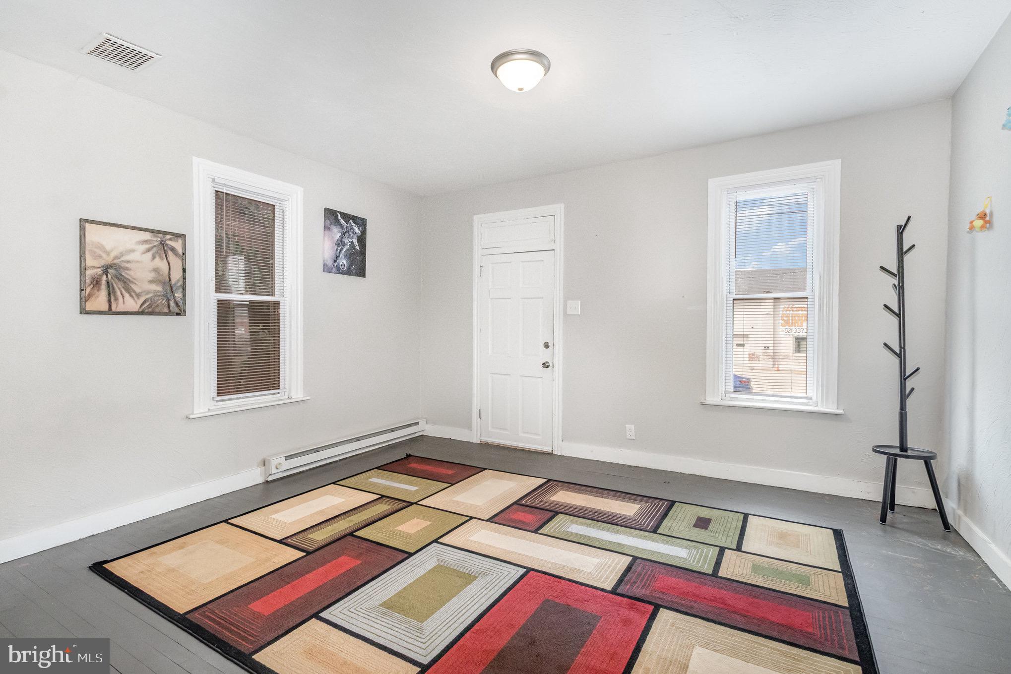 429 High Street Hanover, PA 17331 - Photo 11 of 25 a bed sitting in a bedroom next to a window