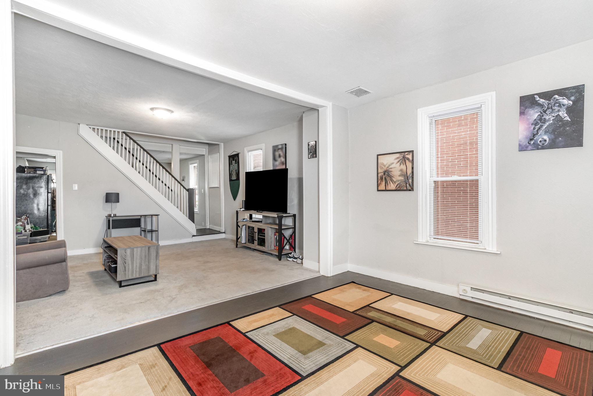 429 High Street Hanover, PA 17331 - Photo 12 of 25 a living room with furniture and a flat screen tv