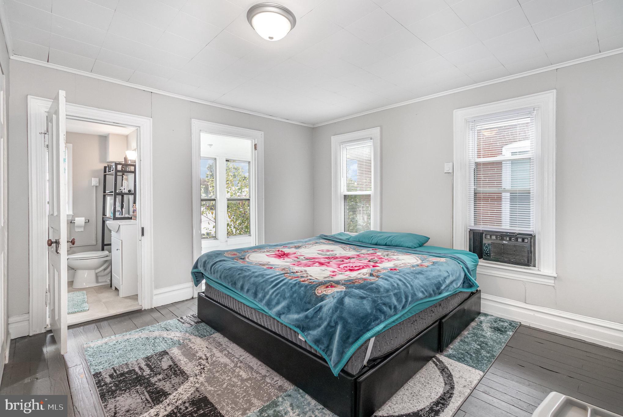 429 High Street Hanover, PA 17331 - Photo 13 of 25 a bedroom with a bed and glass door