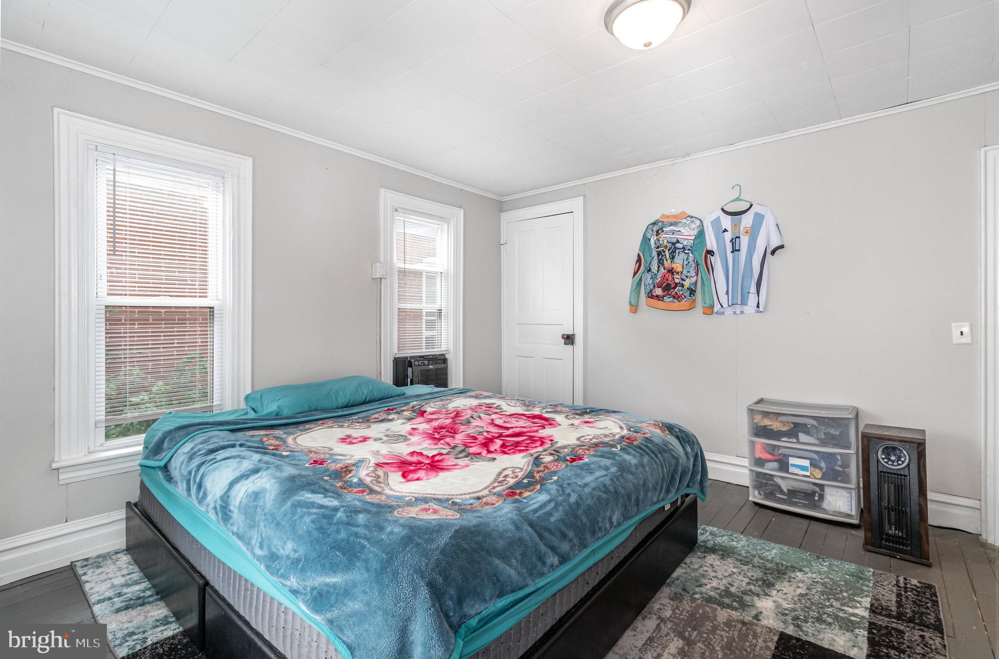 429 High Street Hanover, PA 17331 - Photo 14 of 25 a bedroom with a bed and a painting on the wall