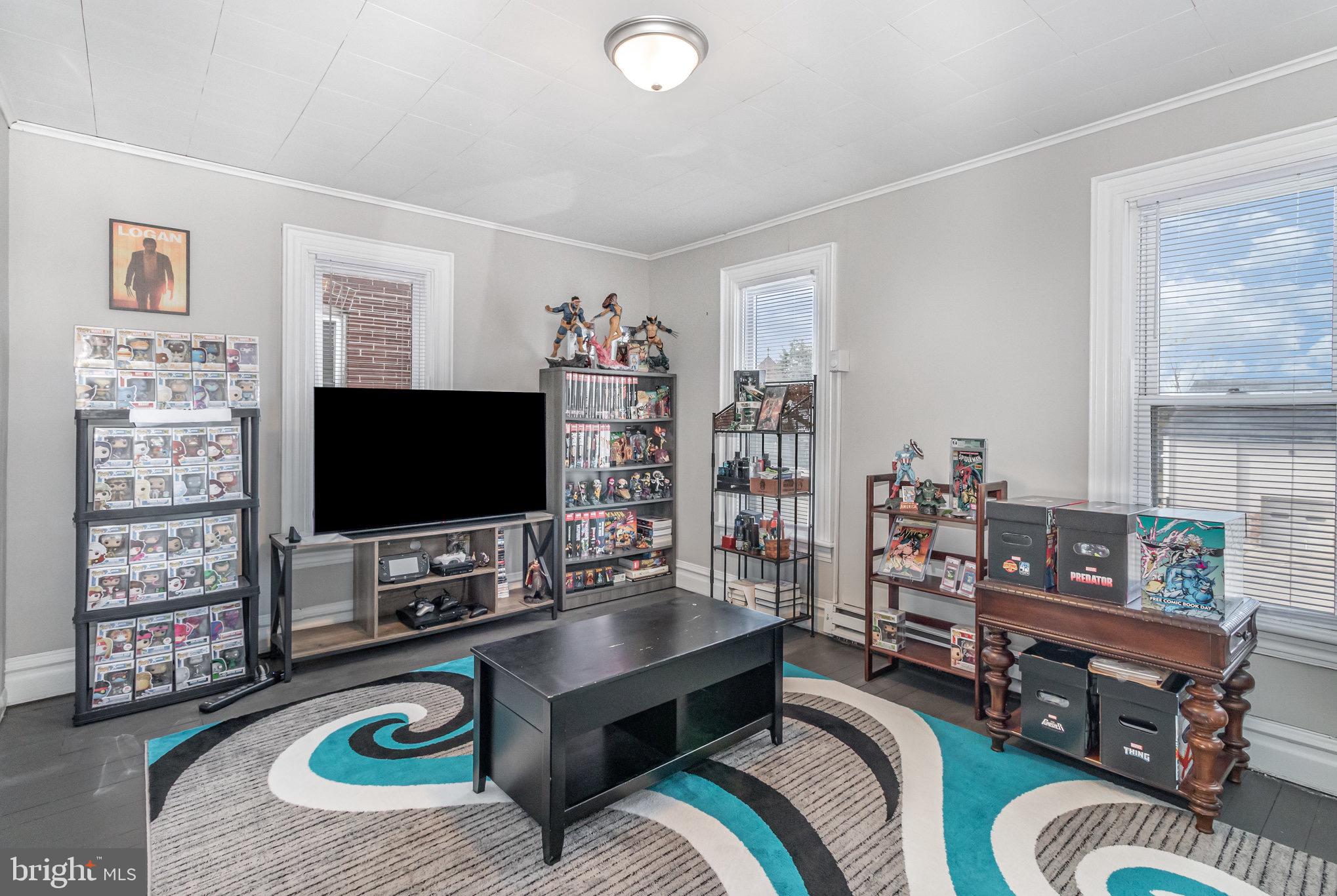 429 High Street Hanover, PA 17331 - Photo 21 of 25 a living room with furniture and a flat screen tv