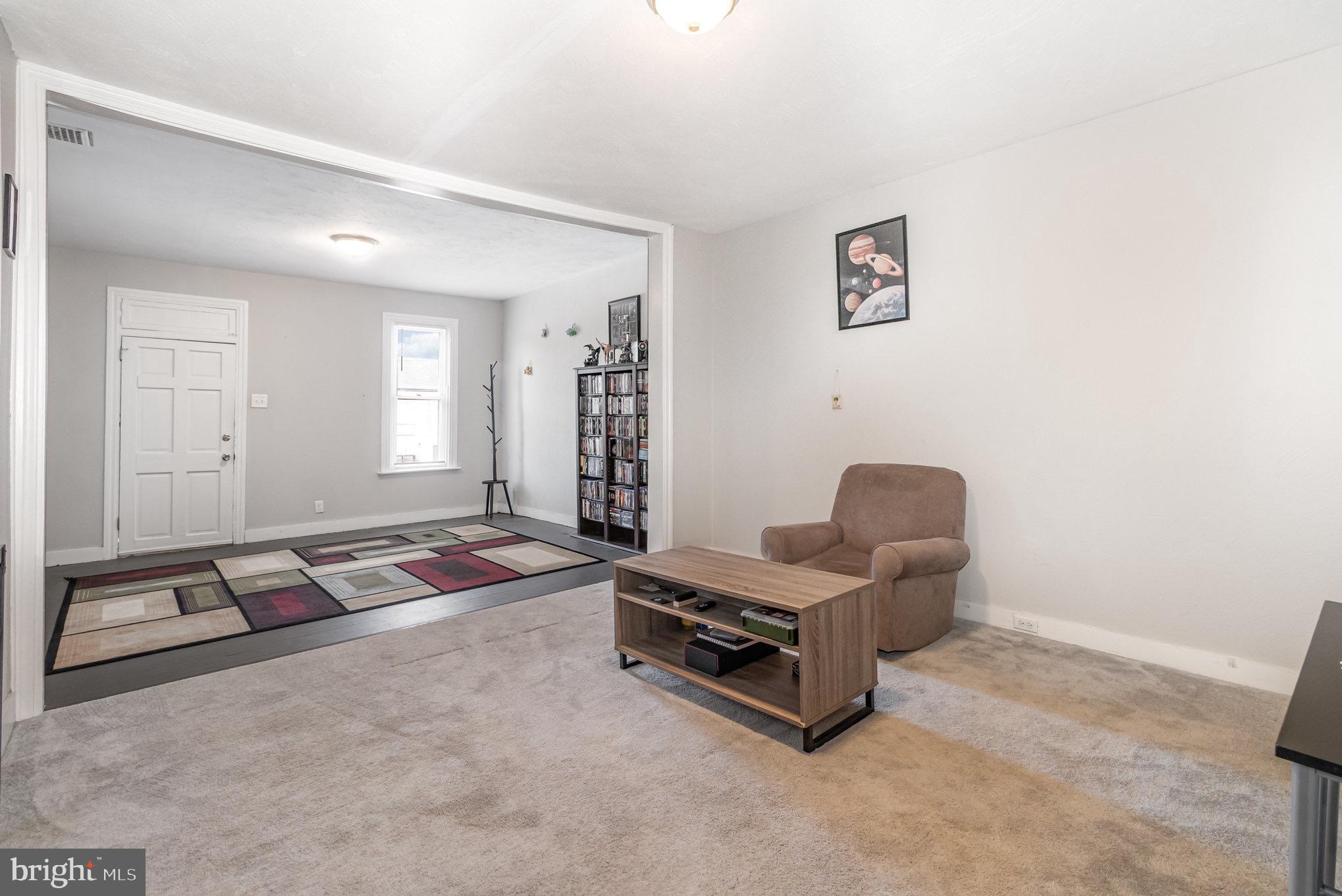 429 High Street Hanover, PA 17331 - Photo 8 of 25 a living room with furniture gym equipment and a window