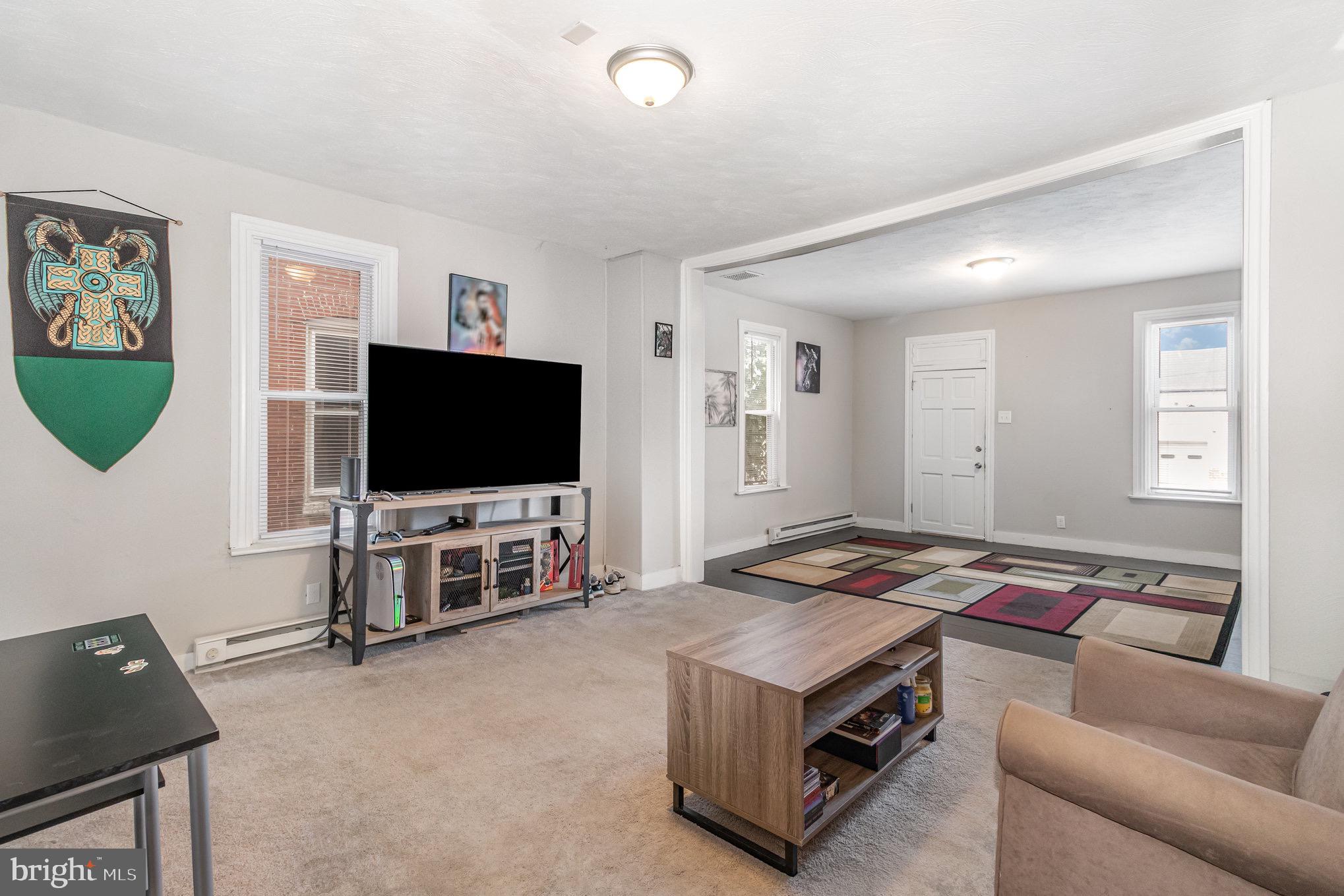 429 High Street Hanover, PA 17331 - Photo 9 of 25 a living room with furniture and a flat screen tv