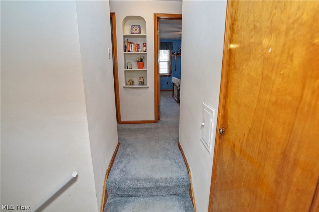 1273 Ford Road Lyndhurst, OH 44124 - Photo 15 of 32 steps leading to 2nd floor landing with built in shelf.