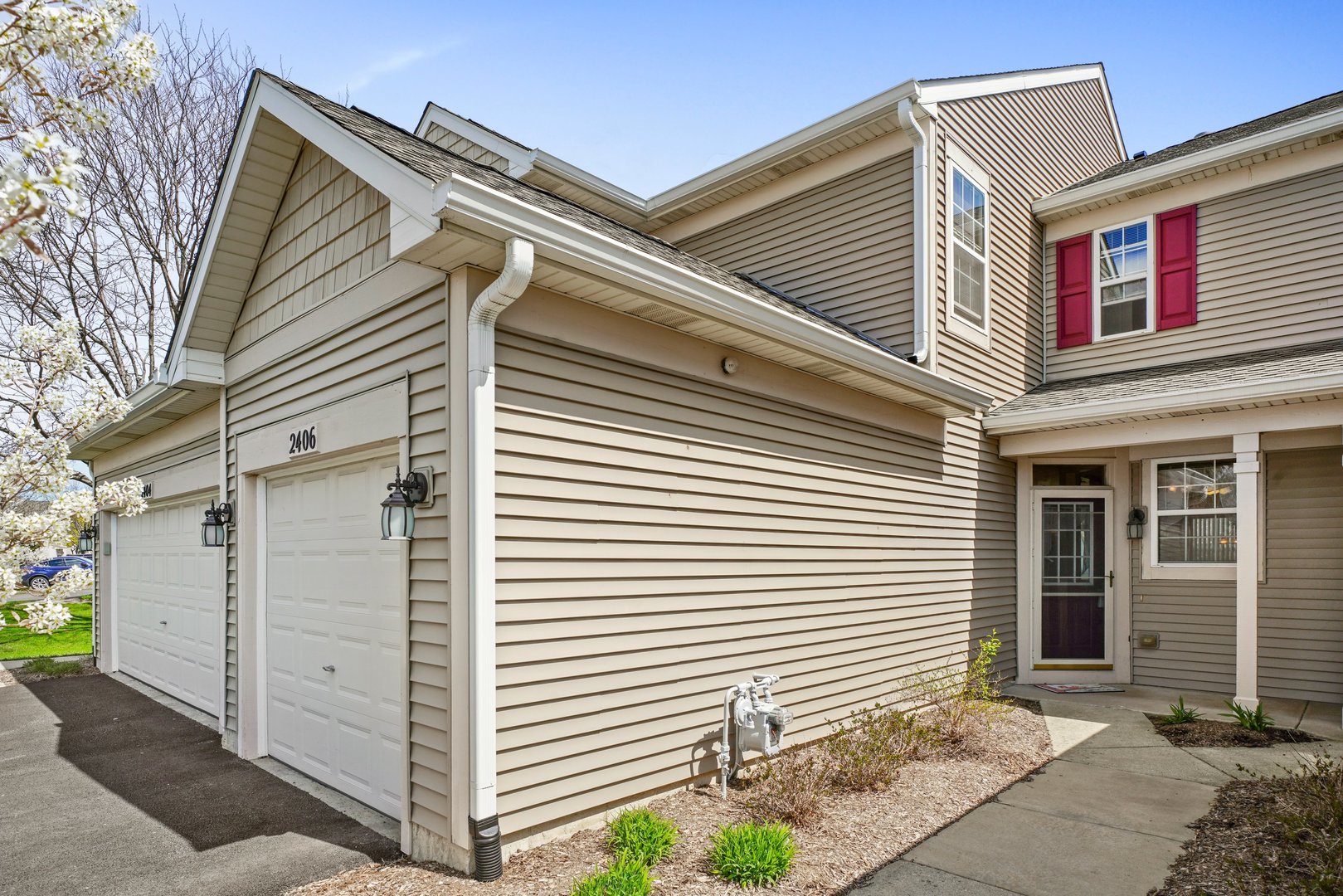 2406 Sheehan Drive Naperville, IL 60564 - Photo 2 of 17 a view of a house with large windows and potted plants