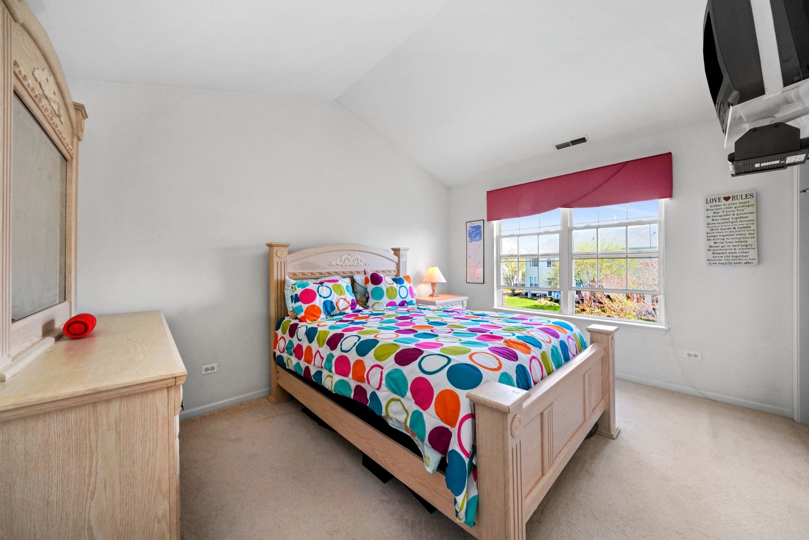 2406 Sheehan Drive Naperville, IL 60564 - Photo 11 of 17 a bedroom with a bed and a dresser next to a window