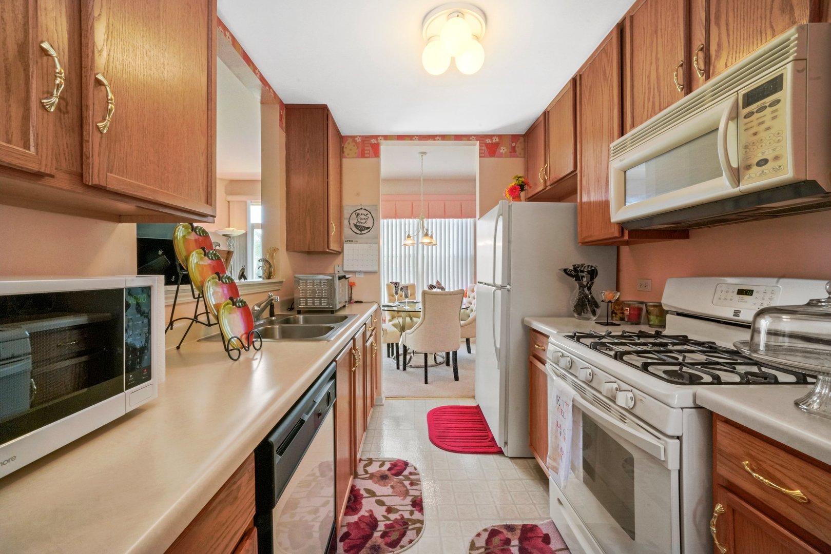 2406 Sheehan Drive Naperville, IL 60564 - Photo 6 of 17 a kitchen with stainless steel appliances granite countertop a stove a sink dishwasher and cabinets with wooden floor