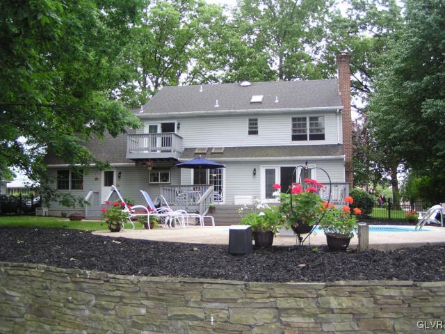 3545 Oakland Road Bethlehem, PA 18020 - Photo 9 of 49 rear of house/stone retaining wall at pool area