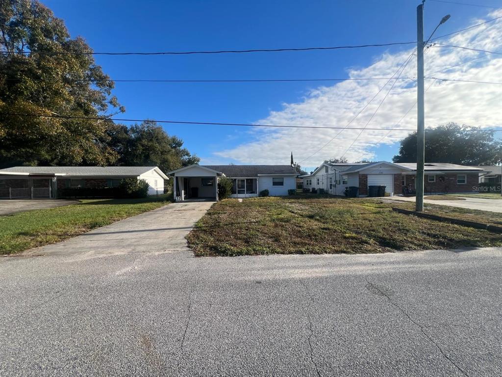 132 Miller Drive Winter Haven, FL 33884 - Photo 2 of 15 a view of a house with a yard