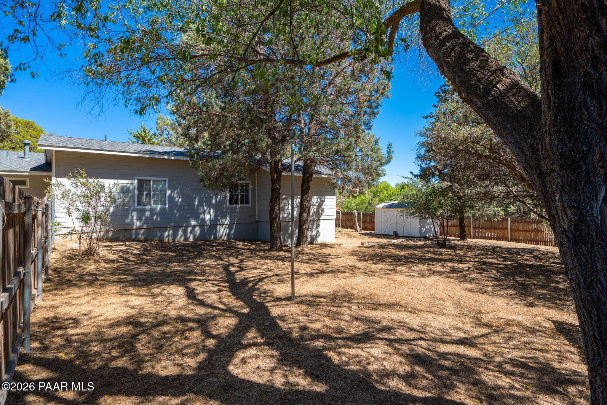 1710 Grandview Road Prescott, AZ 86305 - Photo 39 of 47 a view of a yard with a tree in the background