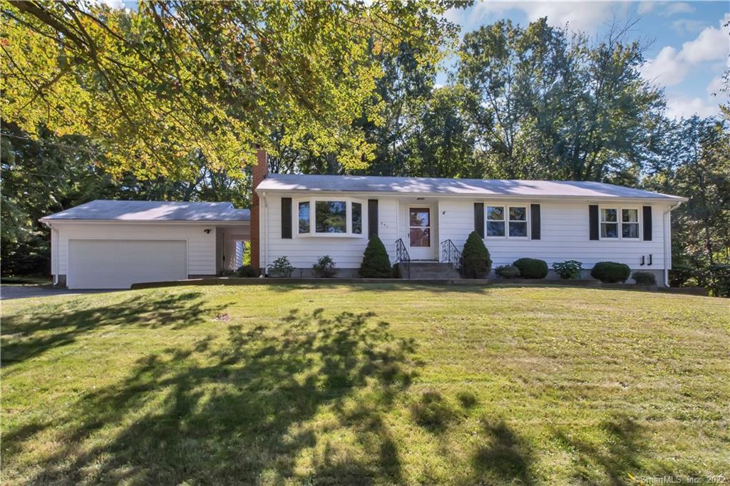551 Old Post Road Tolland, CT 06084 - Photo 1 of 1 a front view of house with yard and trees in the background