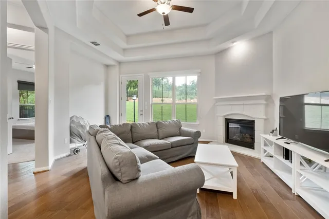 a living room with furniture fireplace and window