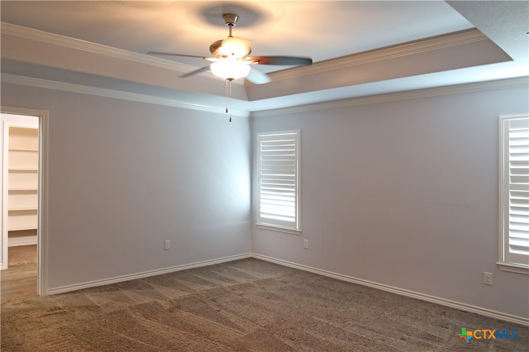 2734 Rock Road Troy, TX 76579 - Photo 16 of 48 an empty room with windows and fan
