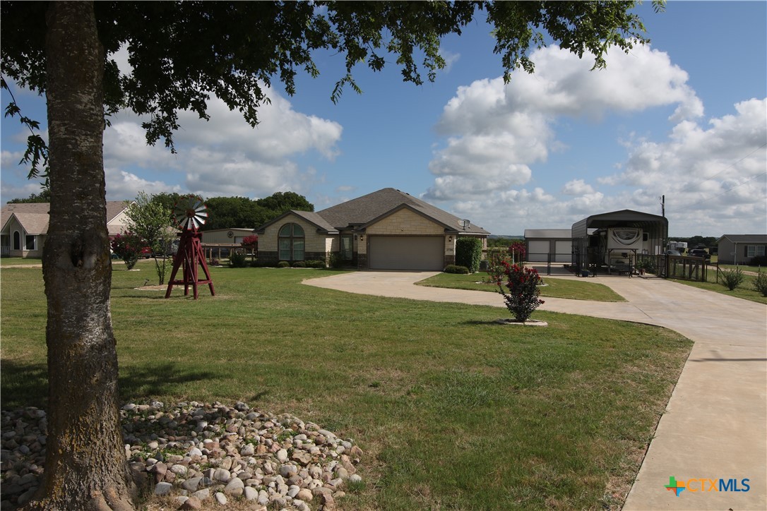 2734 Rock Road Troy, TX 76579 - Photo 2 of 48 a view of a garden with a house