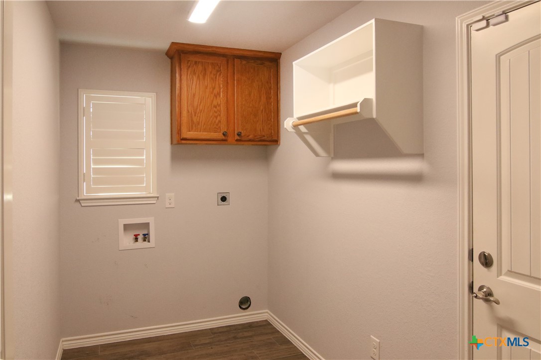 2734 Rock Road Troy, TX 76579 - Photo 33 of 48 a view of an empty room with wooden floor and a window
