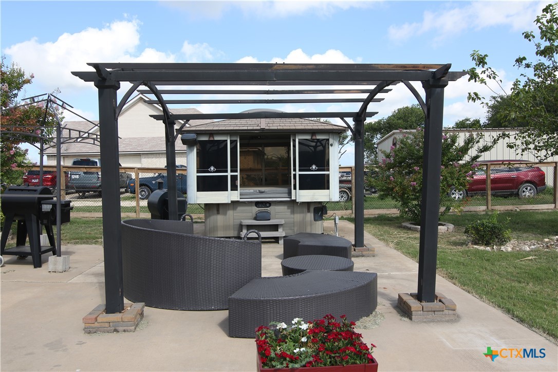 2734 Rock Road Troy, TX 76579 - Photo 35 of 48 a view of a patio with table and chairs potted plants with lake view